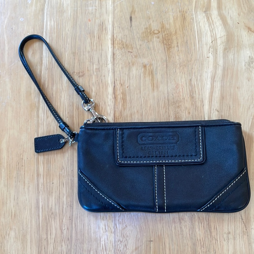 nice Coach wristlet. All black leather with top zip closure. Looks never used.